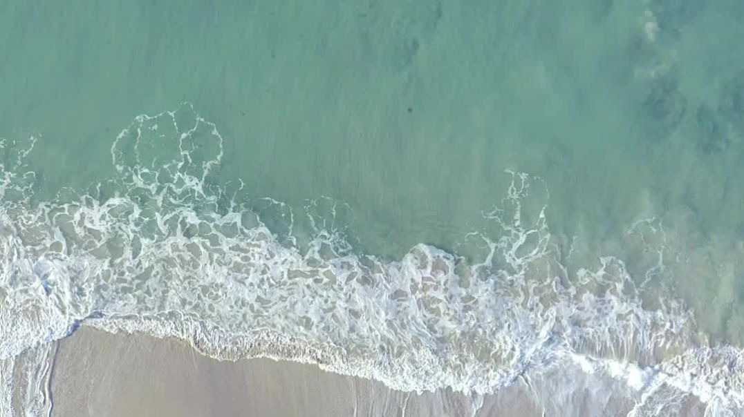 mixkit-aerial-view-of-the-beautiful-turquoise-waves-crashing-on-the-51500-full-hd